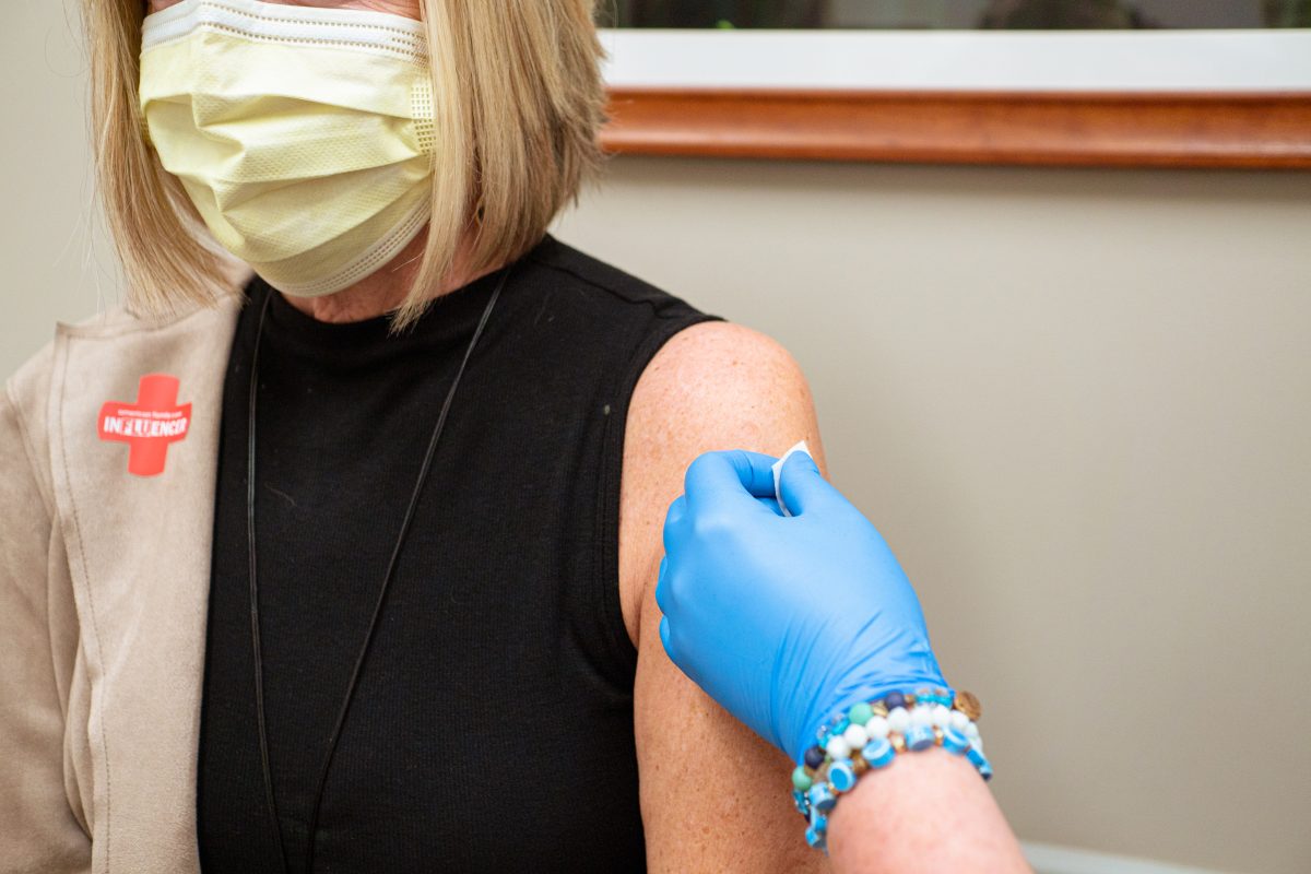 Patient receiving flu shot vaccine at AFC Urgent Care Huntersville 