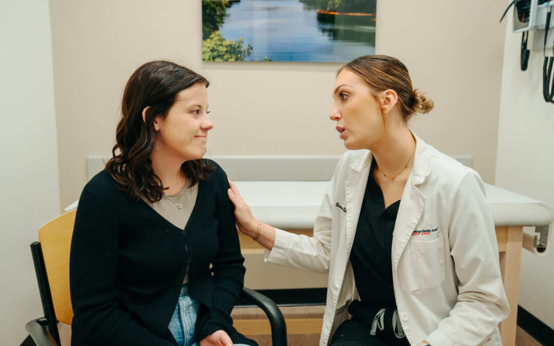 AFC provider and patient discussing treatment